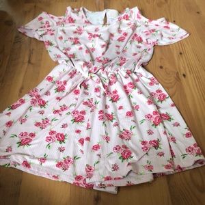 Short romper pink flowers and striped background.